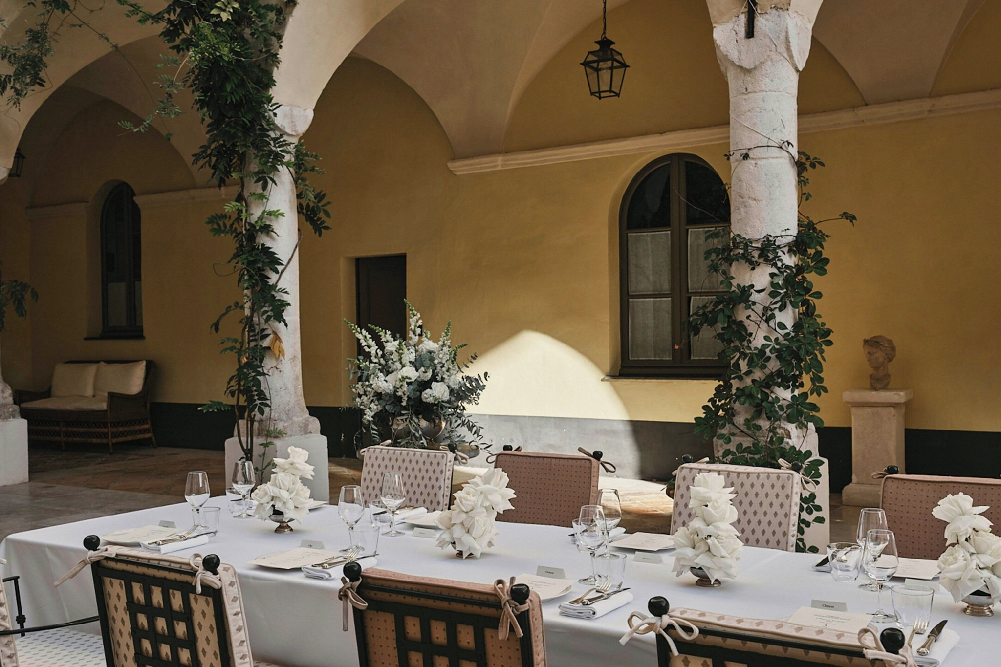 Dining table under the Hotel du Couvent cloister arches