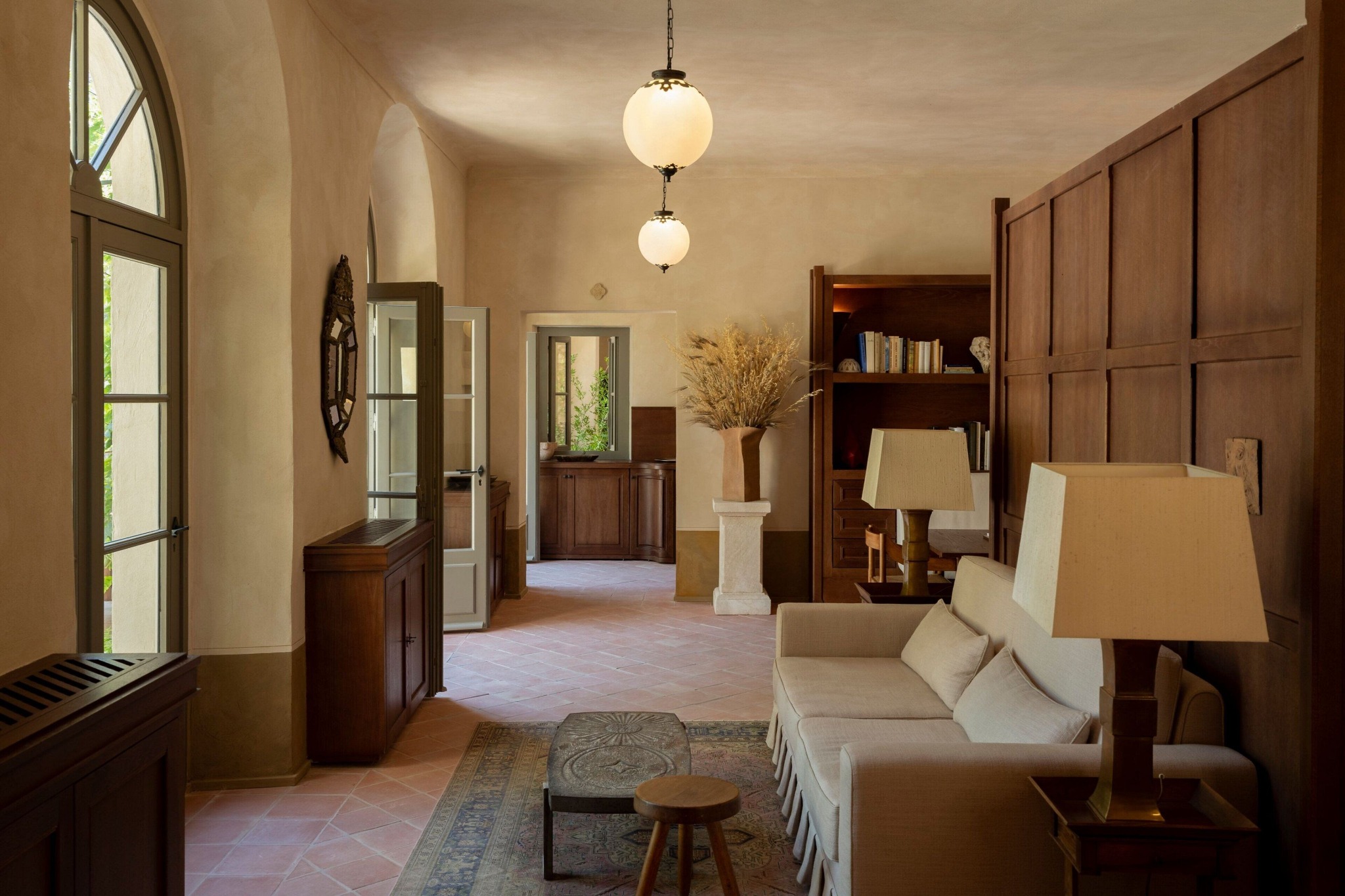 Hotel du Couvent suite with natural tones and dark wood